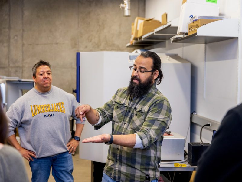 Instructor explaining something to students.