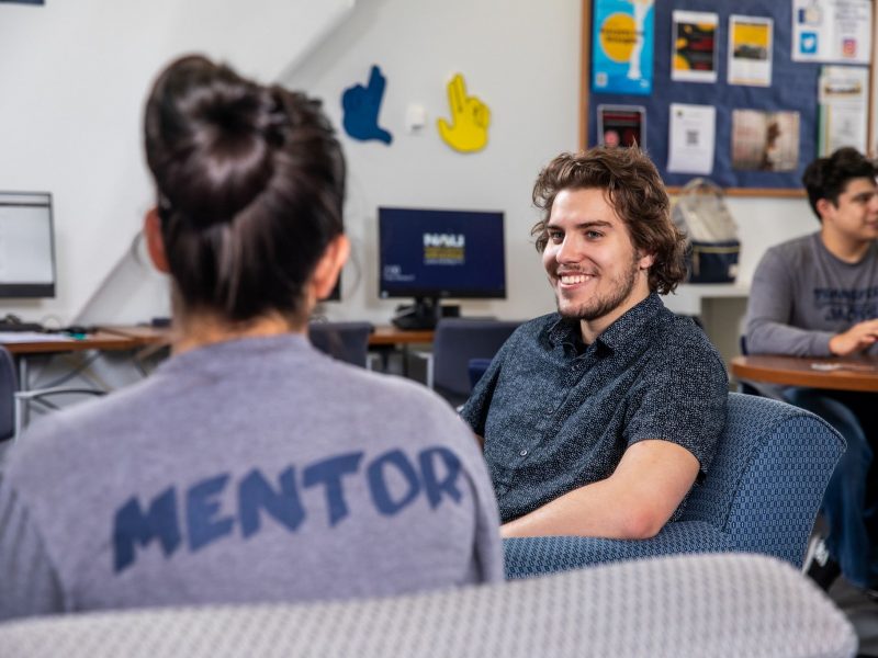 Student getting help at mentoring programs.