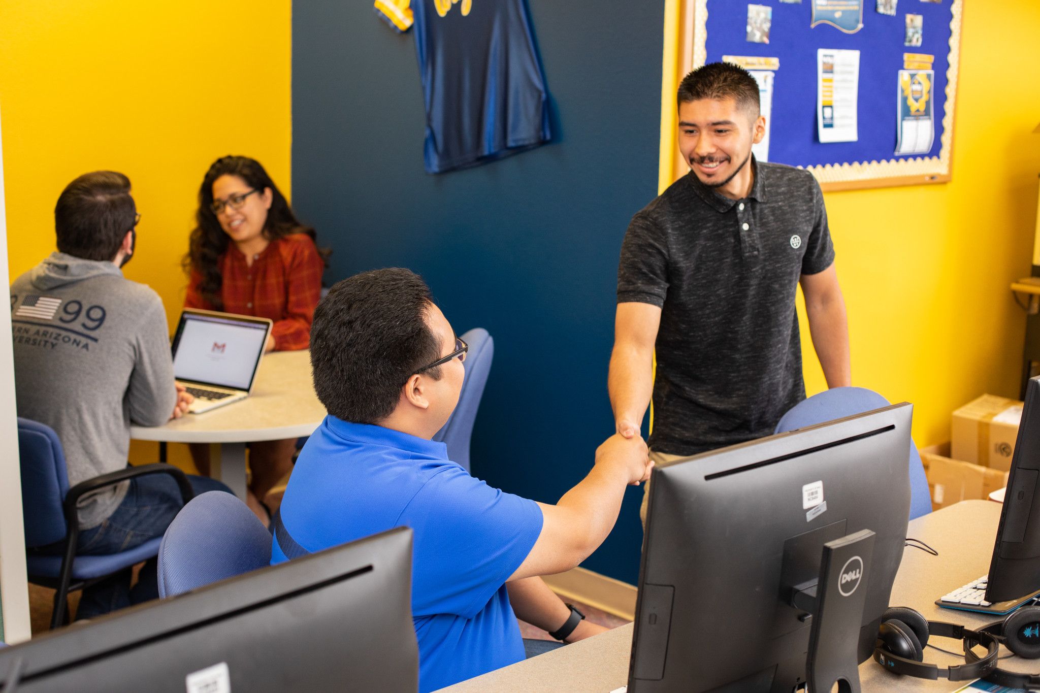 Peer Jack Mentors helping student on the N A U Yuma campus.
