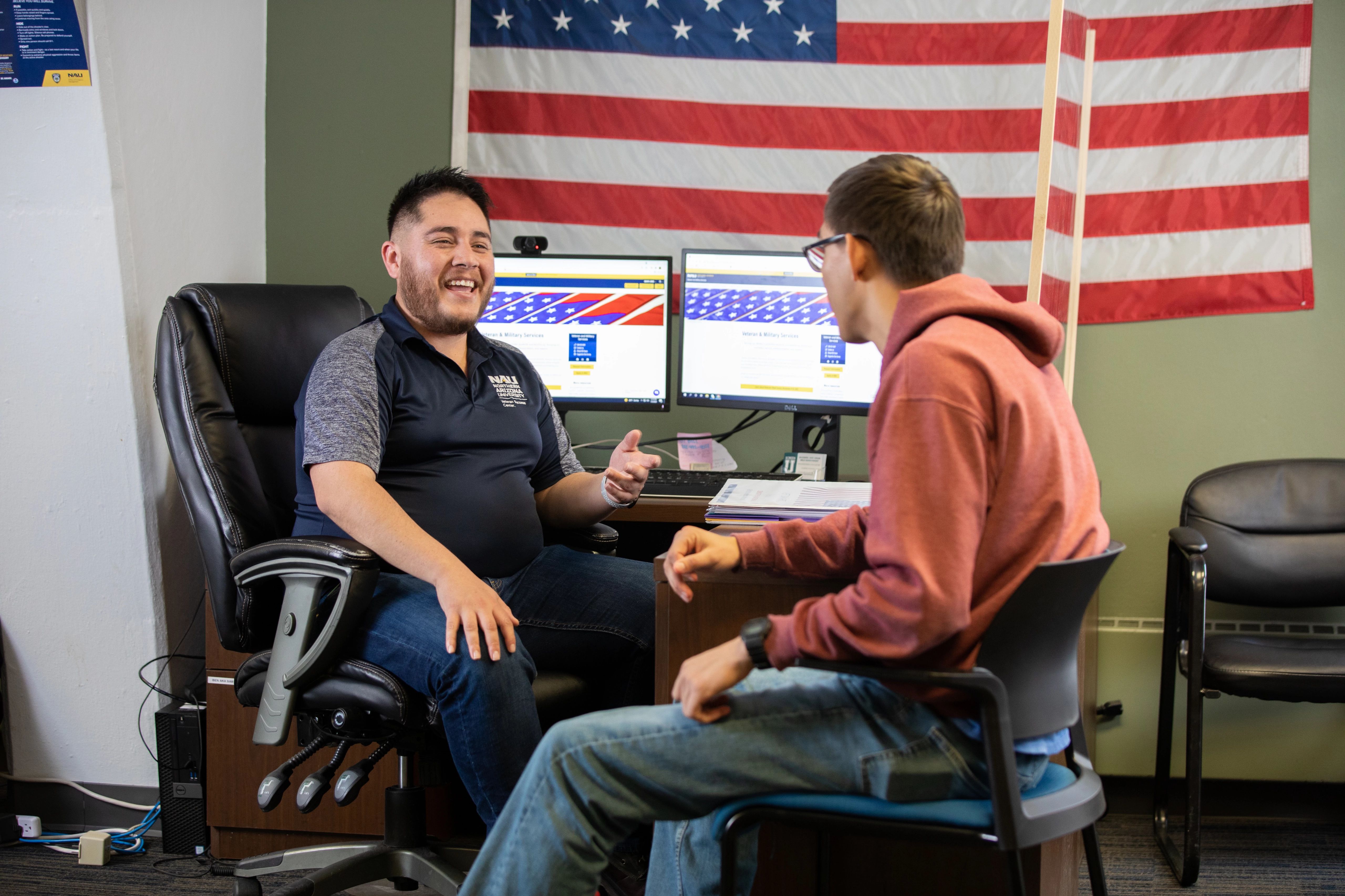 Student receiving advising help at Veteran Success Center.