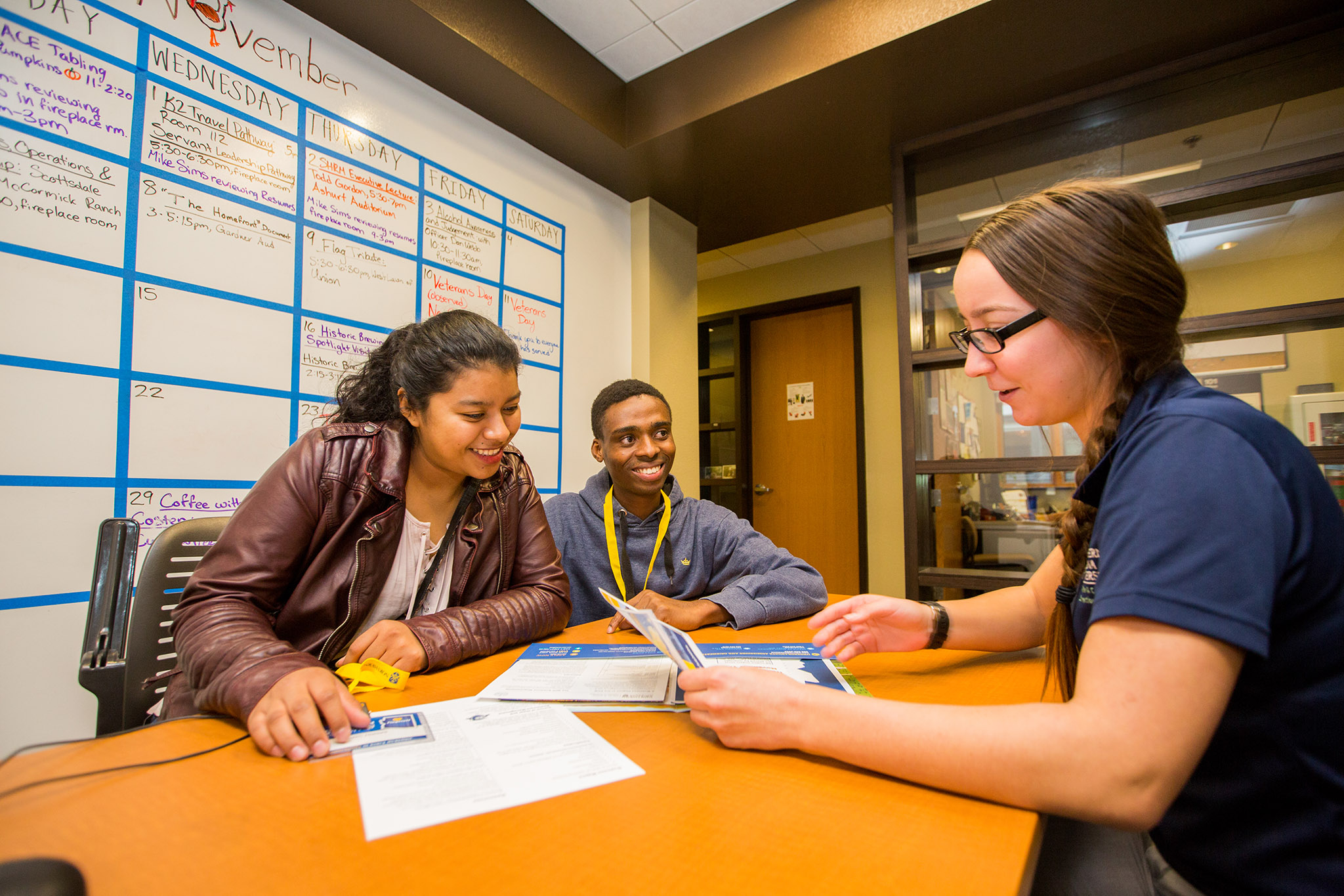 Students visiting N A U talking to mentors on Transfer Visit Day.