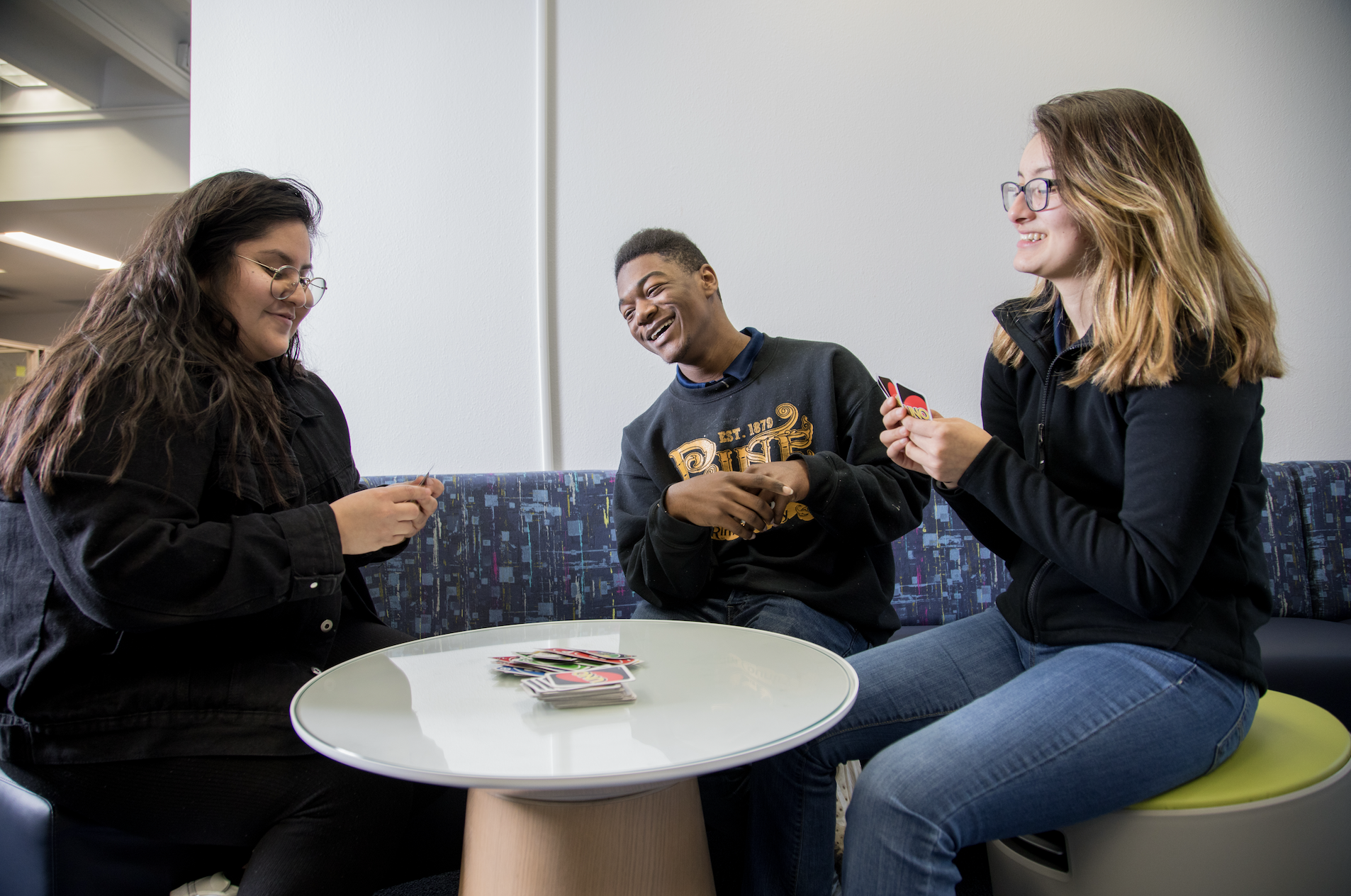 Indigenous students wearing S K O Jacks shirts gather on the soccer field.