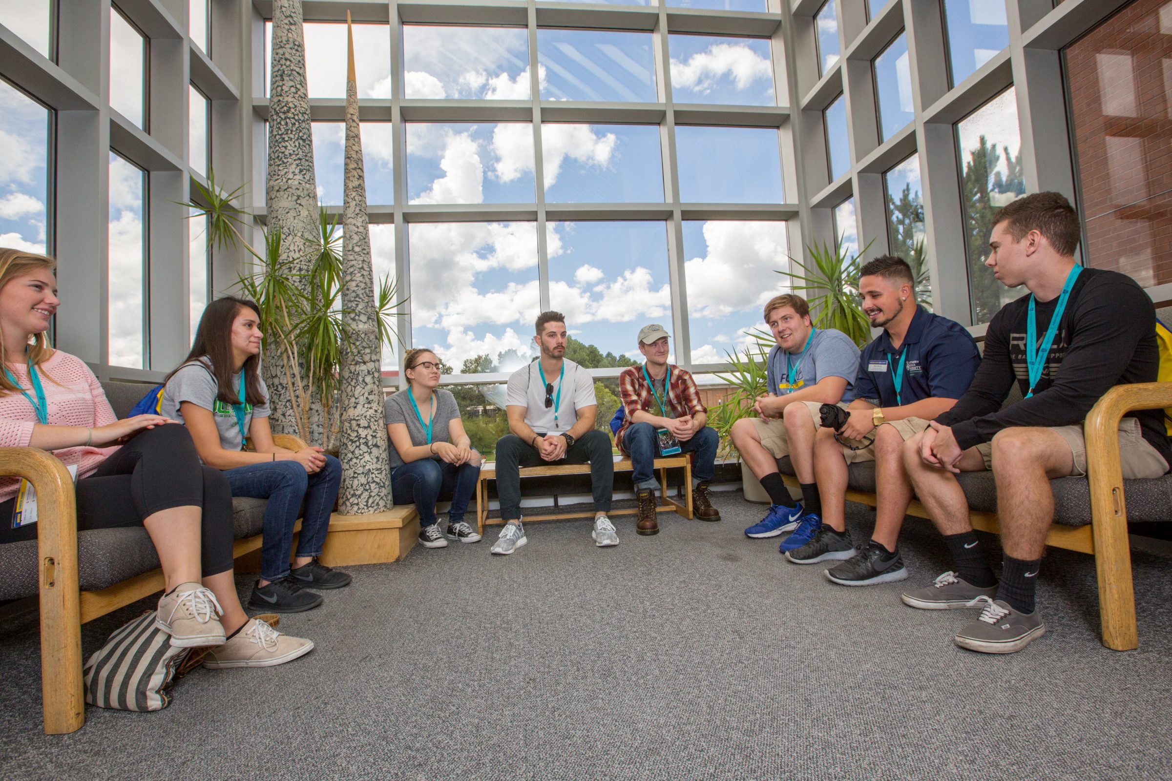 A group of transfer students at orientation, chatting.