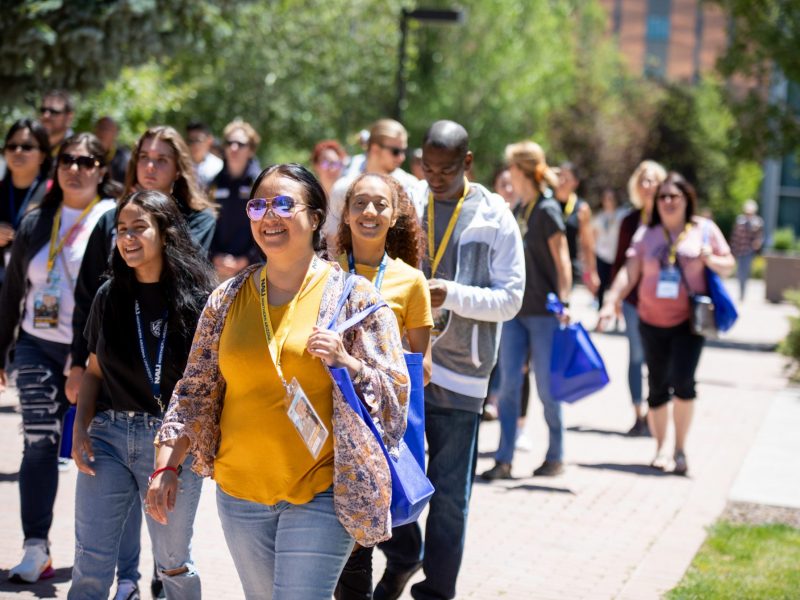 Freshmen students walking on the ped-way at N A U's Flagstaff campus for new student orientation.