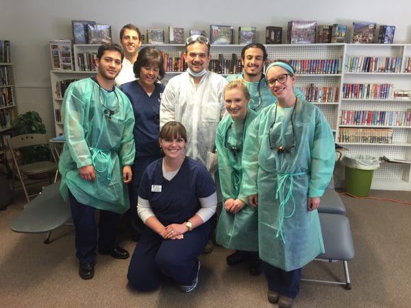 A group of dental hygienists wearing scrubs.