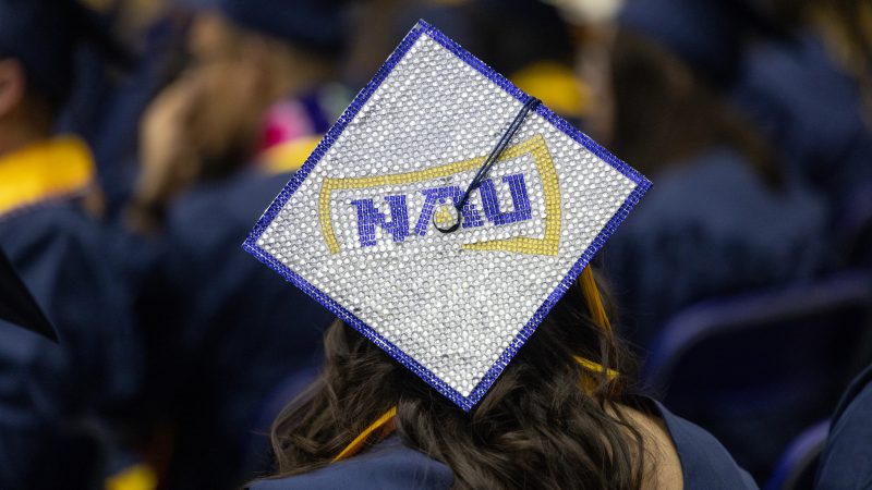 N A U graduation cap.