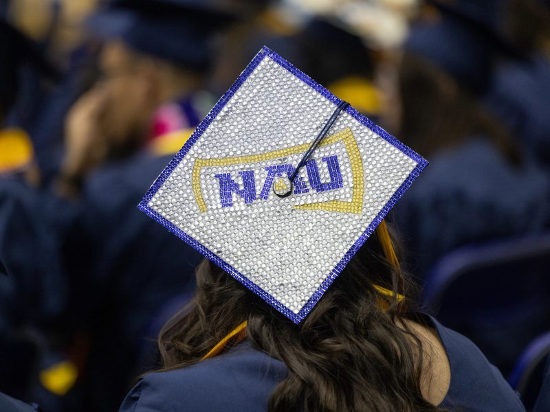 N A U graduation cap.