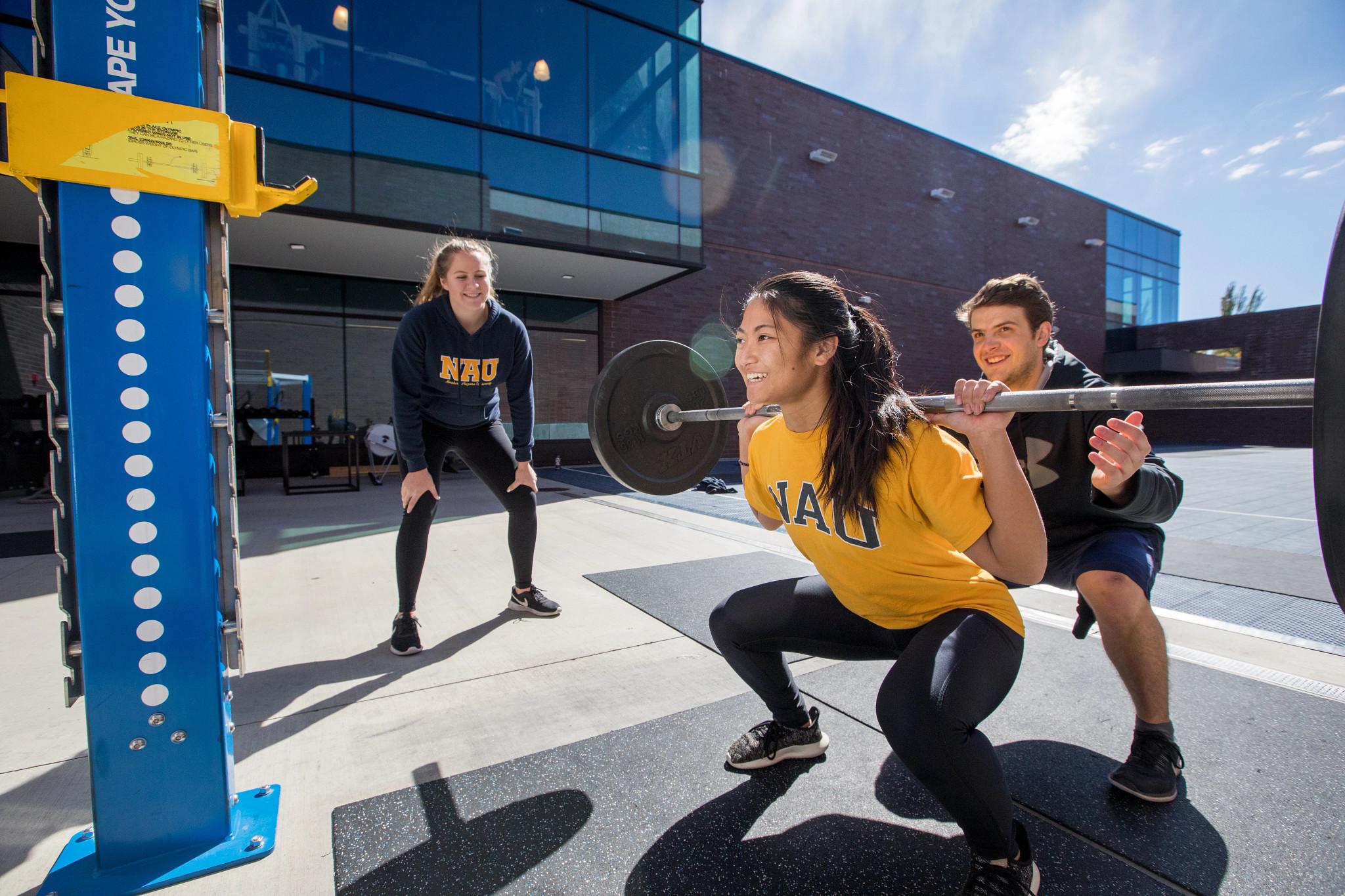 Student lifting weights.