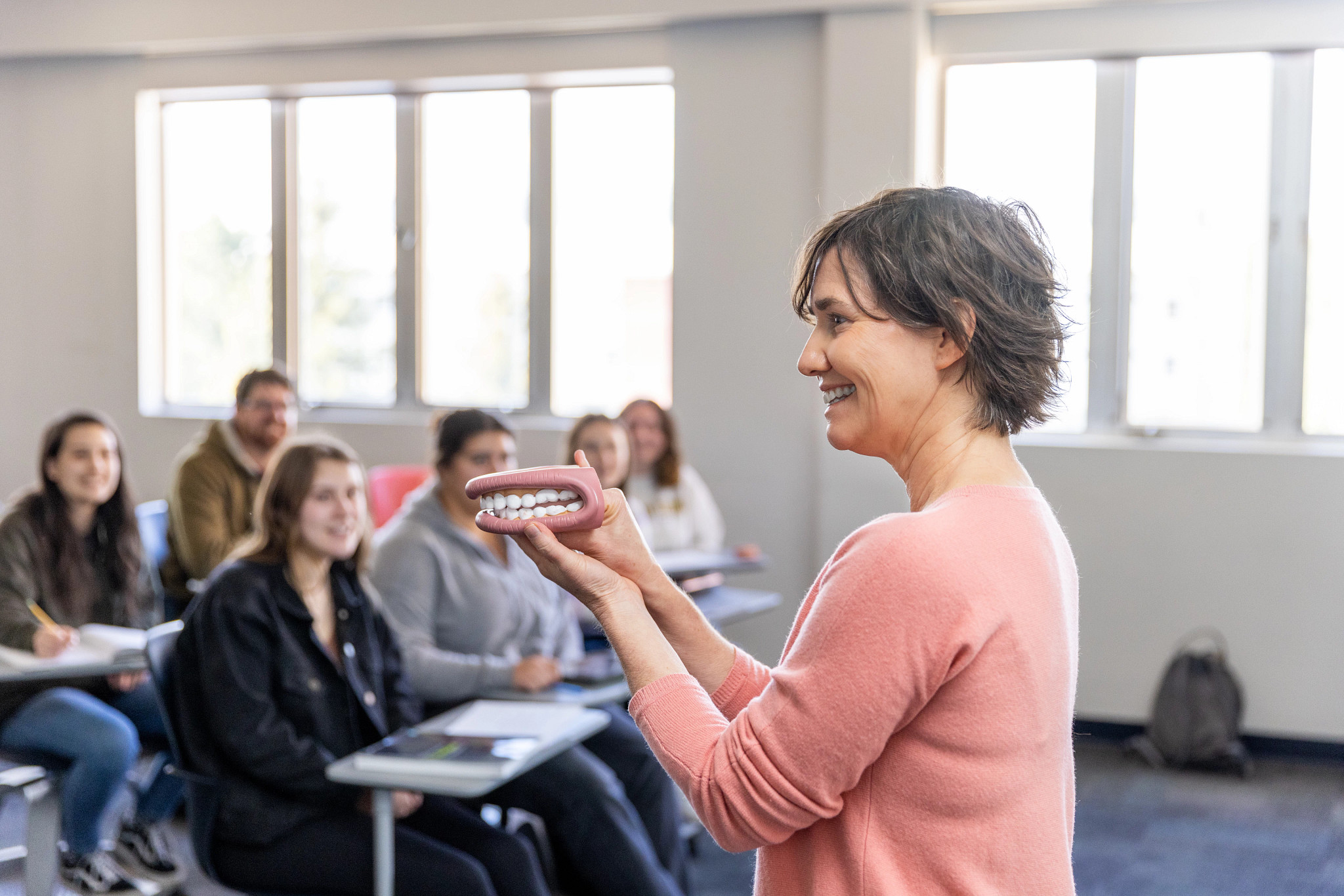 Instructor talking to a class of students.