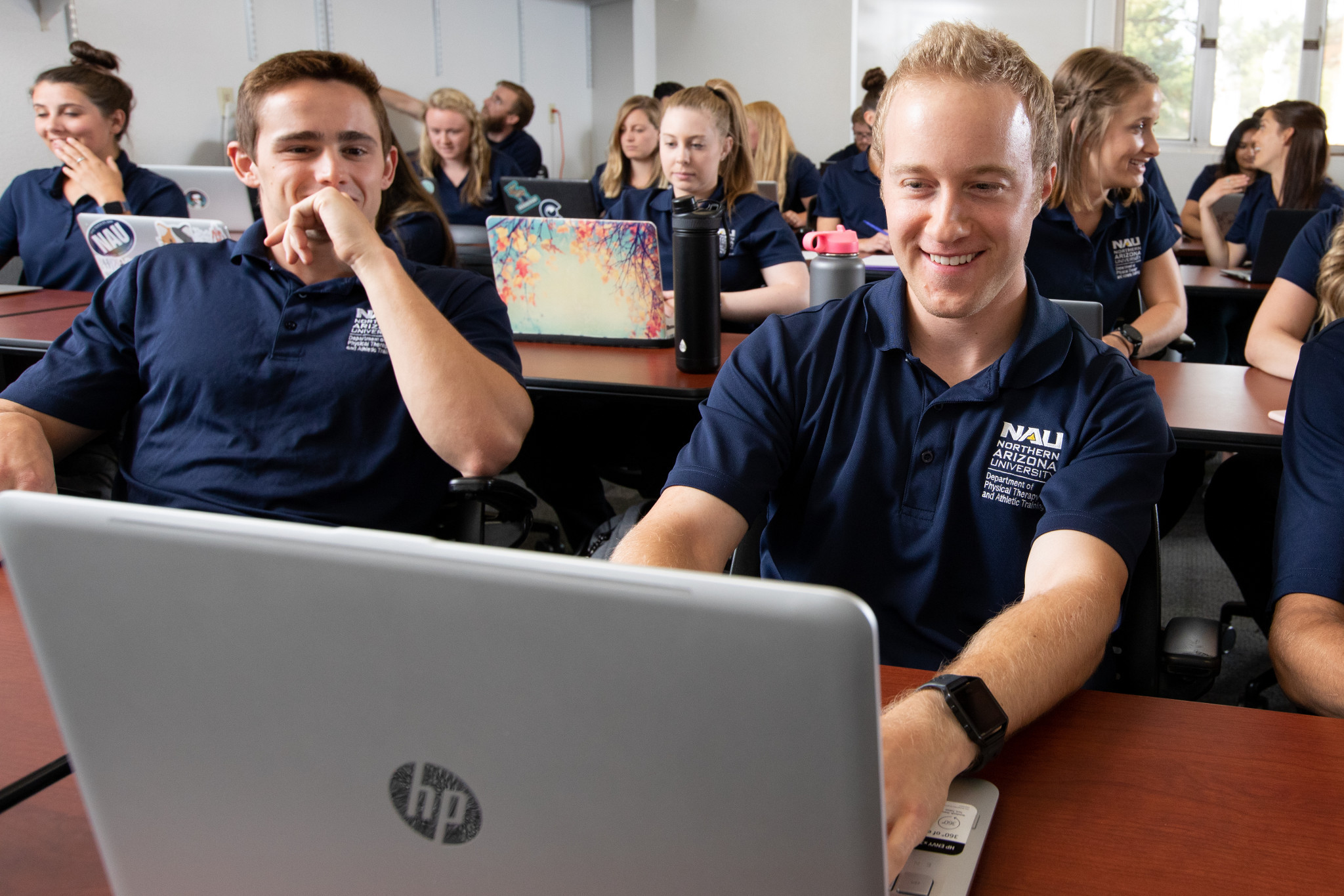 A classroom full of students working on their computers.