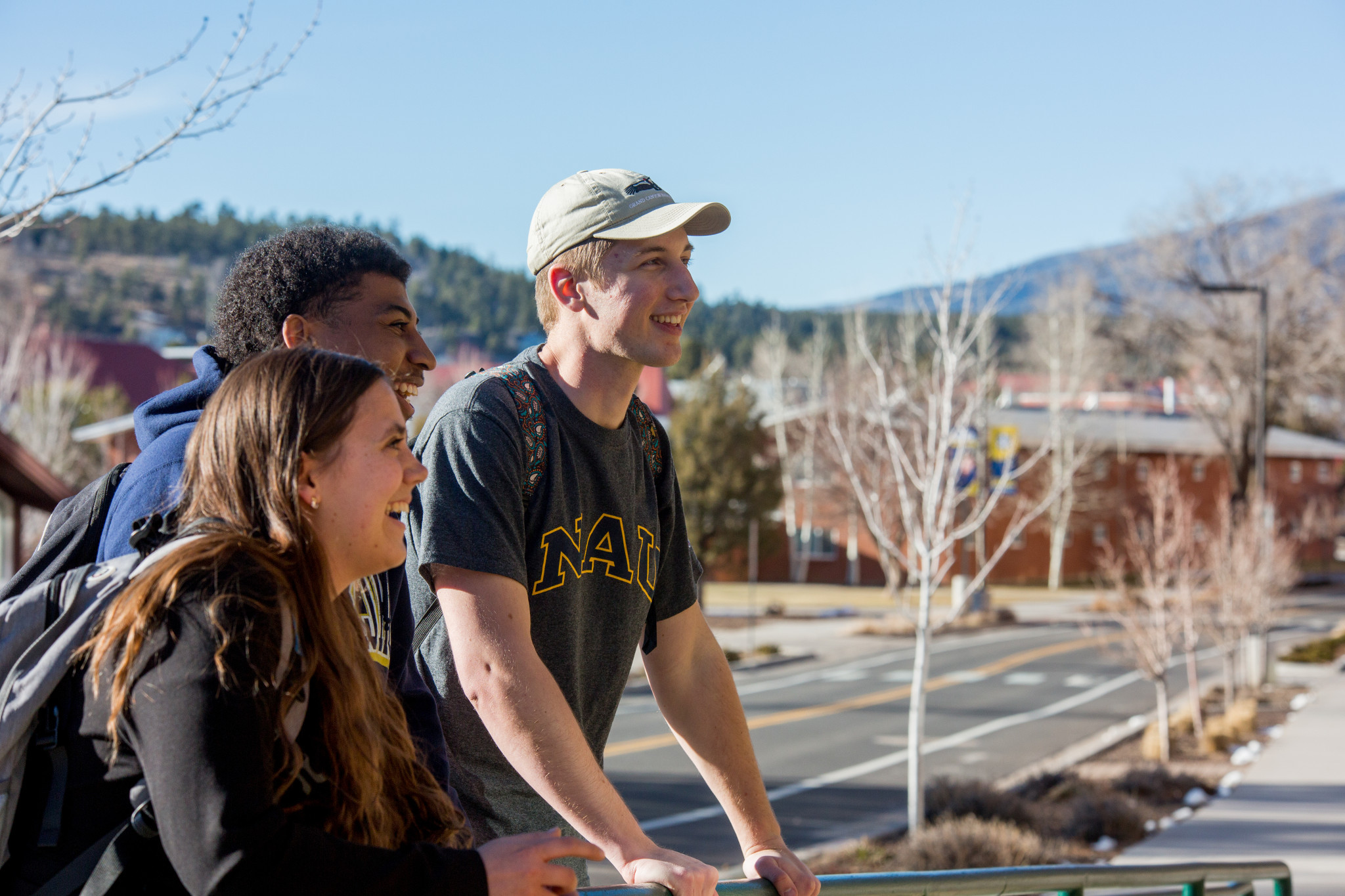 Students outside, smiling.