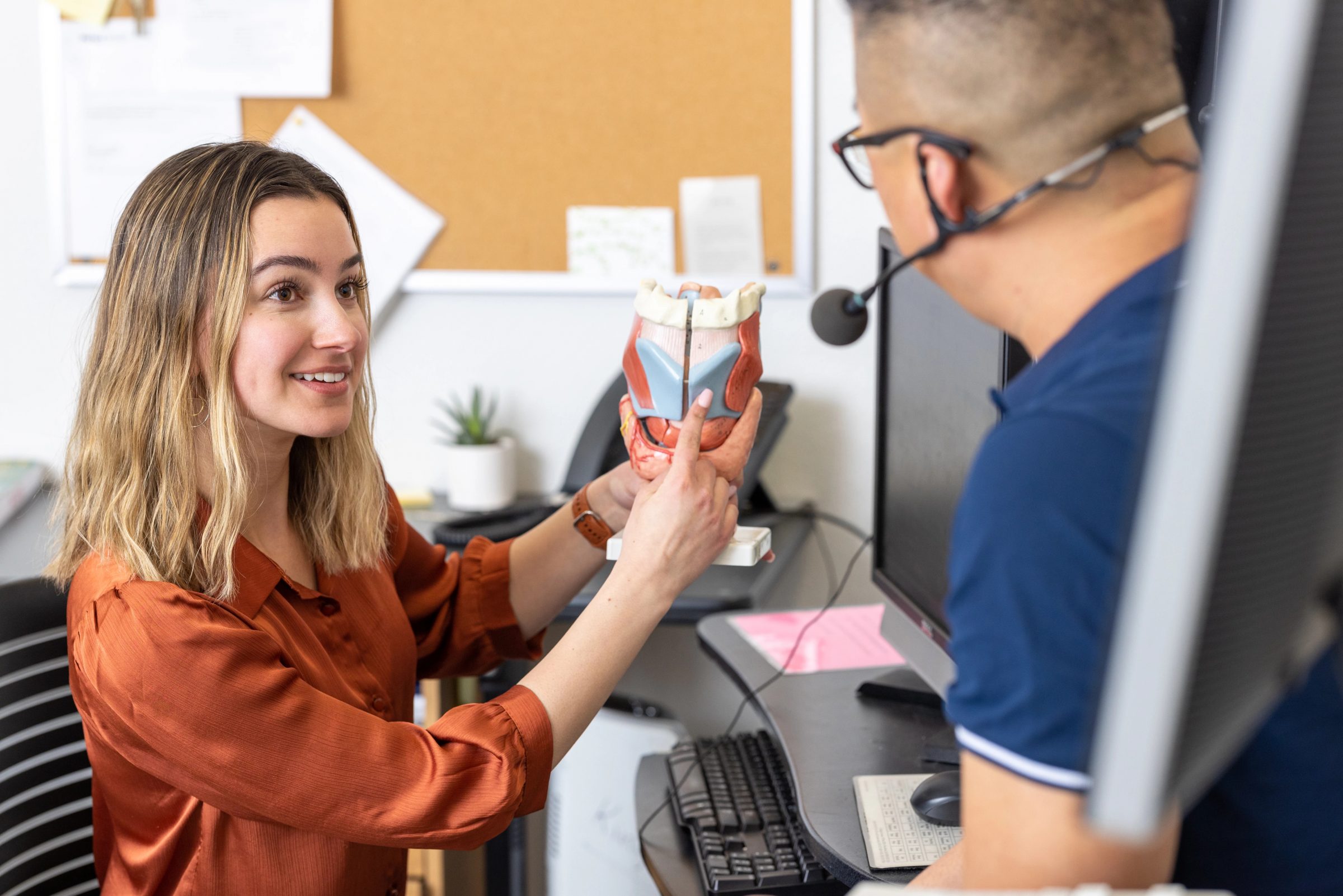 Lab student measuring a liquid.