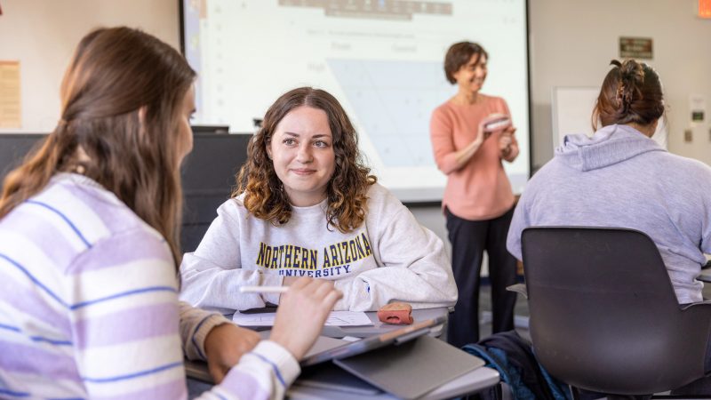 Students discussing their work during class.