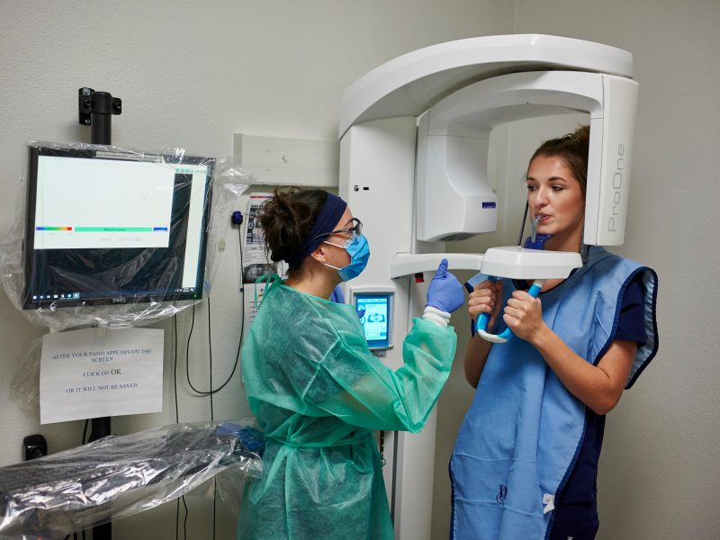 Students learn how to use the dental x-ray machine.