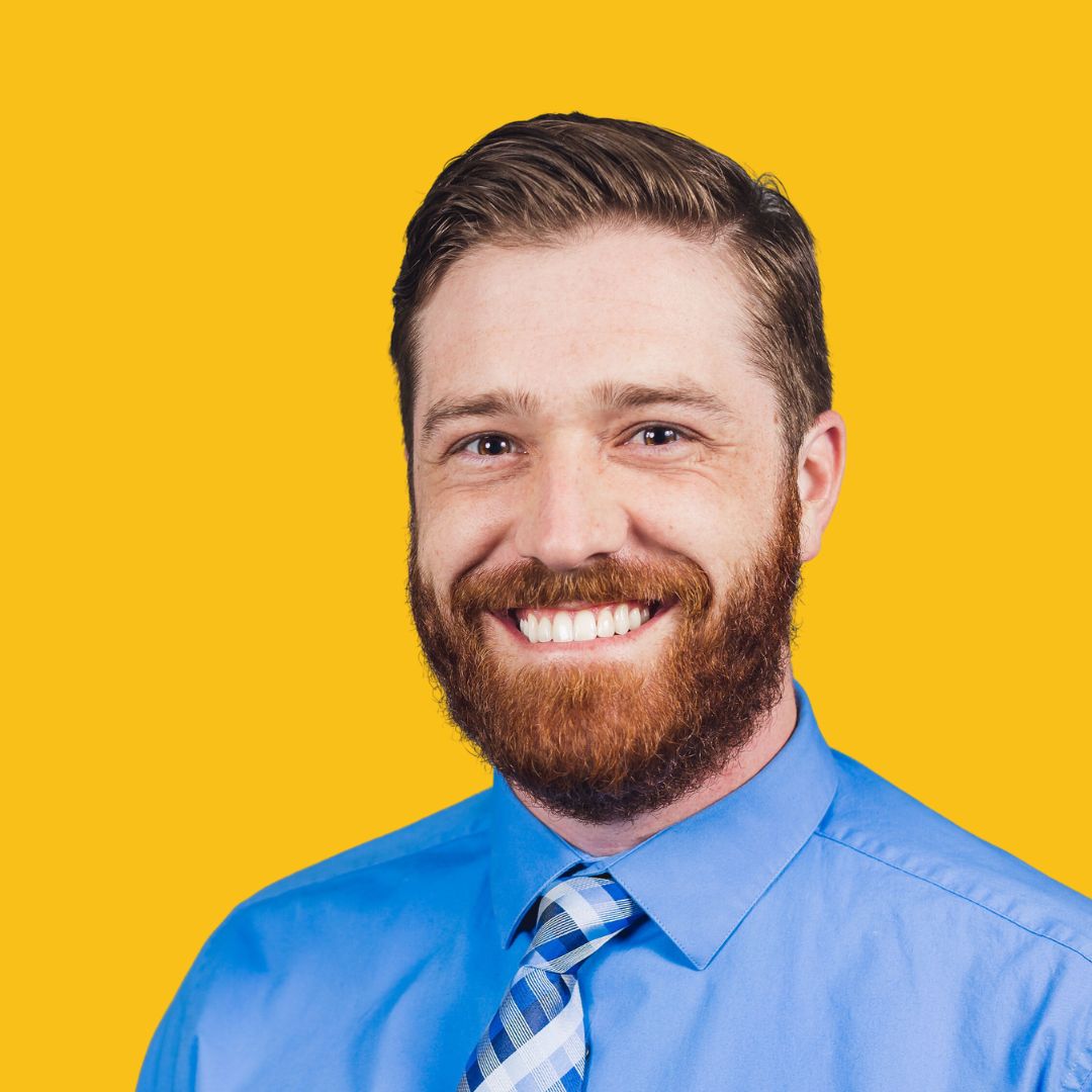 A headshot of Zachary Baker.