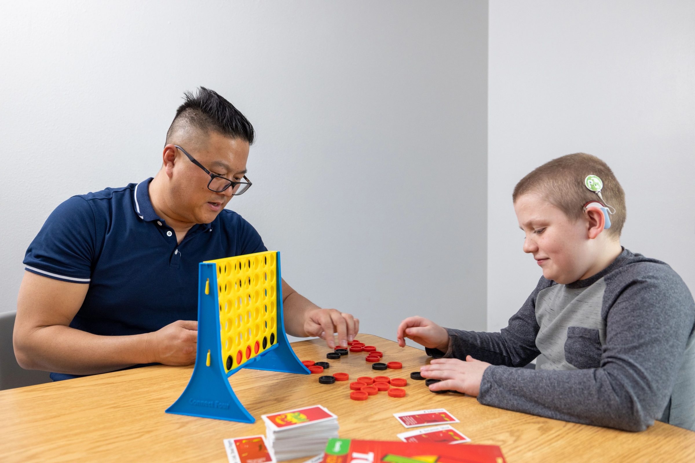 Two adults teaching in the speech and hearing clinic in Flagstaff.