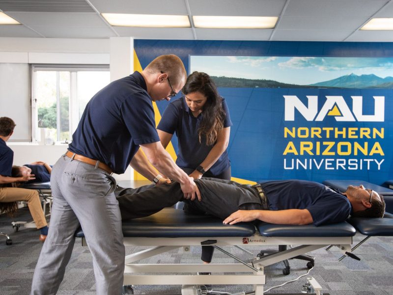 Physical therapy students practicing.