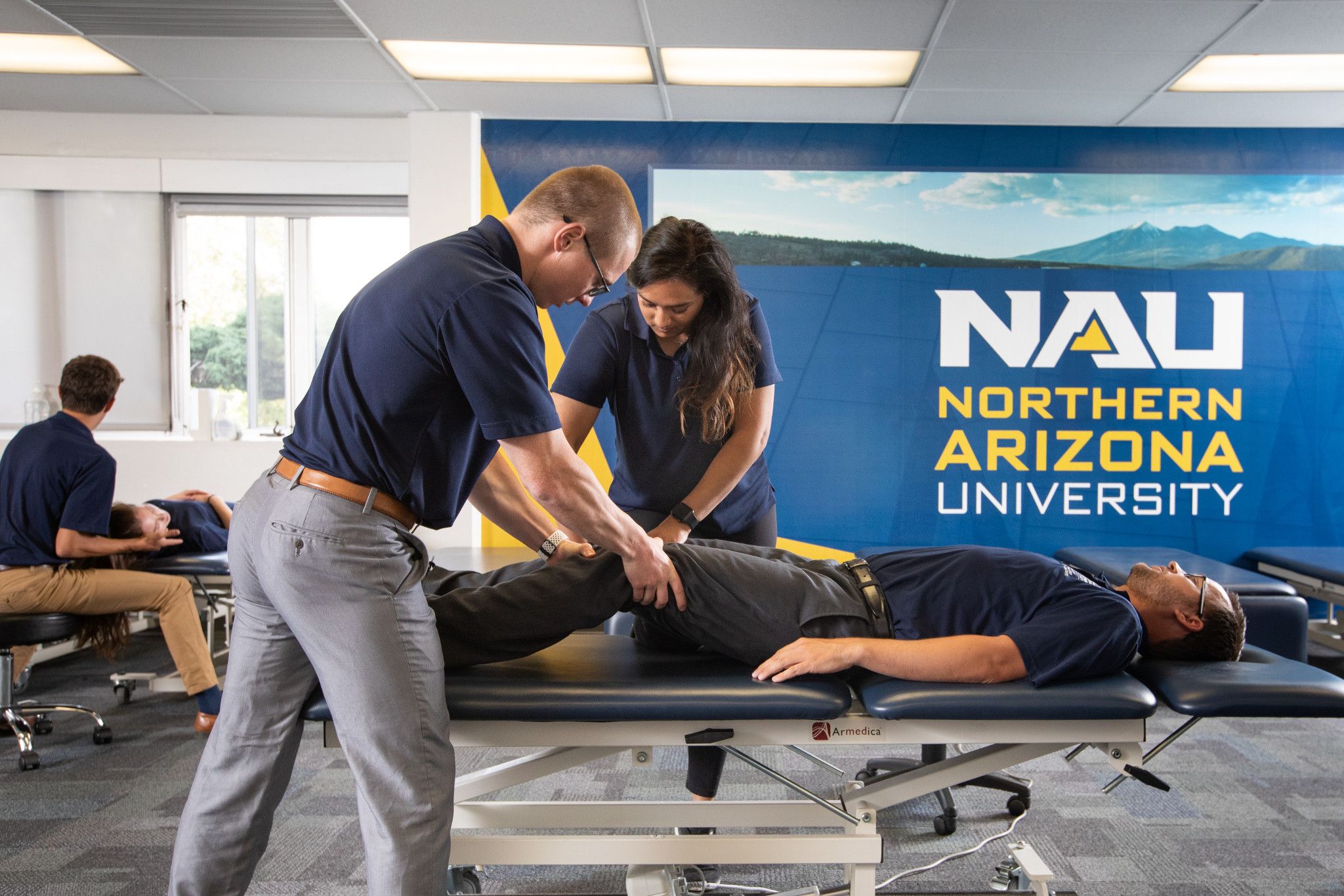 Physical therapy students practicing.