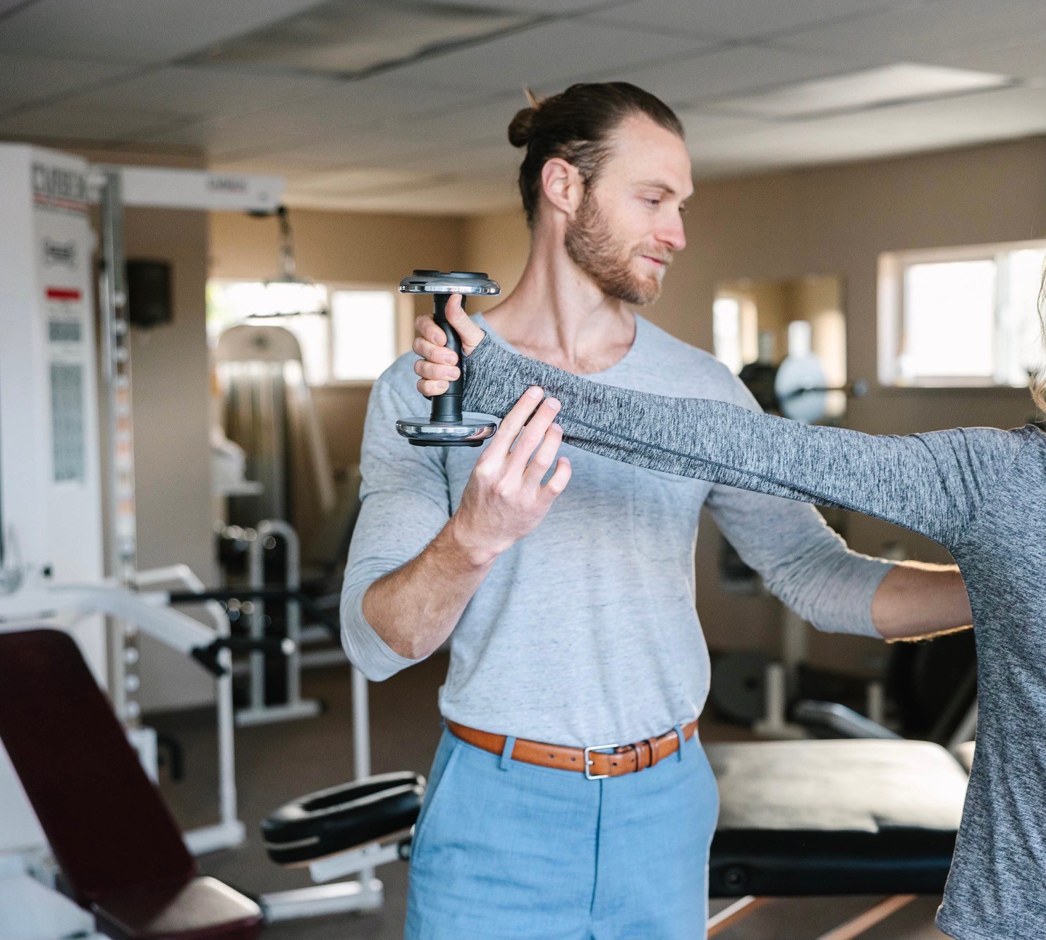 Physical Therapist and N A U alumni, Dustin Titcomb, working with a client.