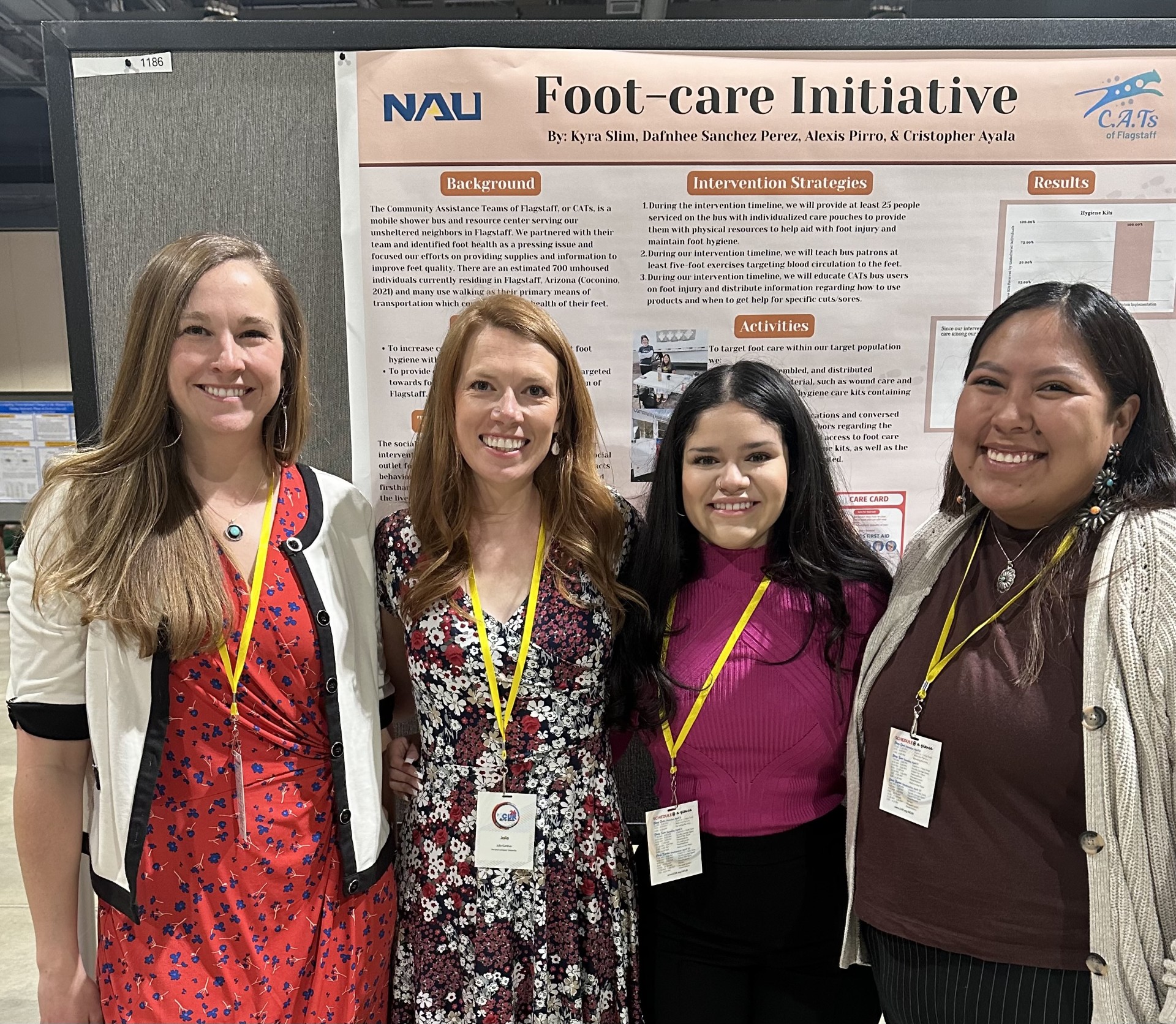 A group of people smiling at an event.