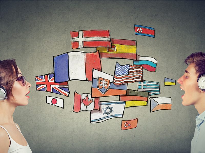 Two people with headphones talking.