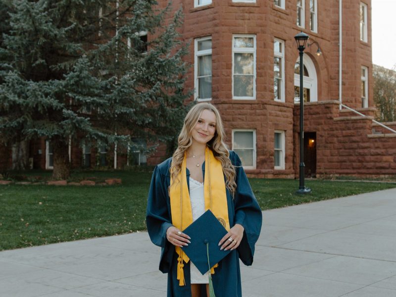Sierra Guenther, Nutrition and Foods graduate from NAU, smiling in her cap and gown.