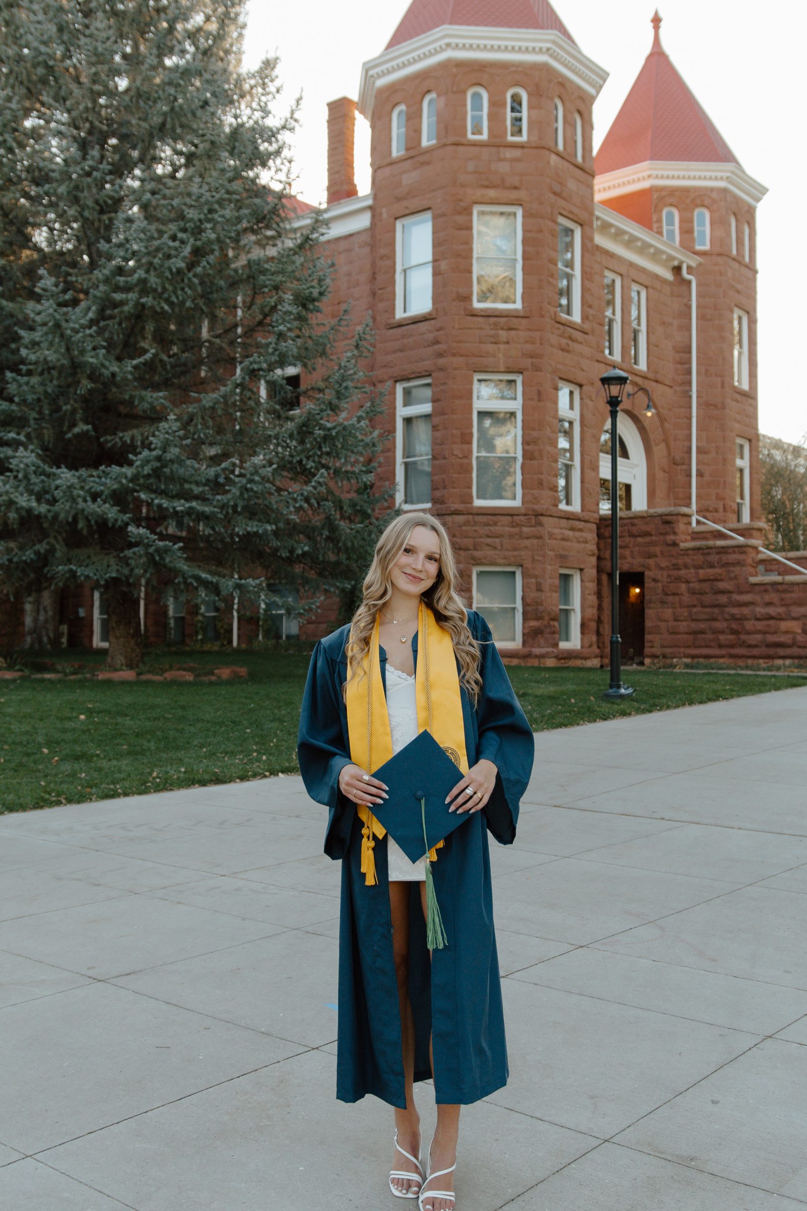 Sierra Guenther, Nutrition and Foods graduate from NAU, smiling in her cap and gown.