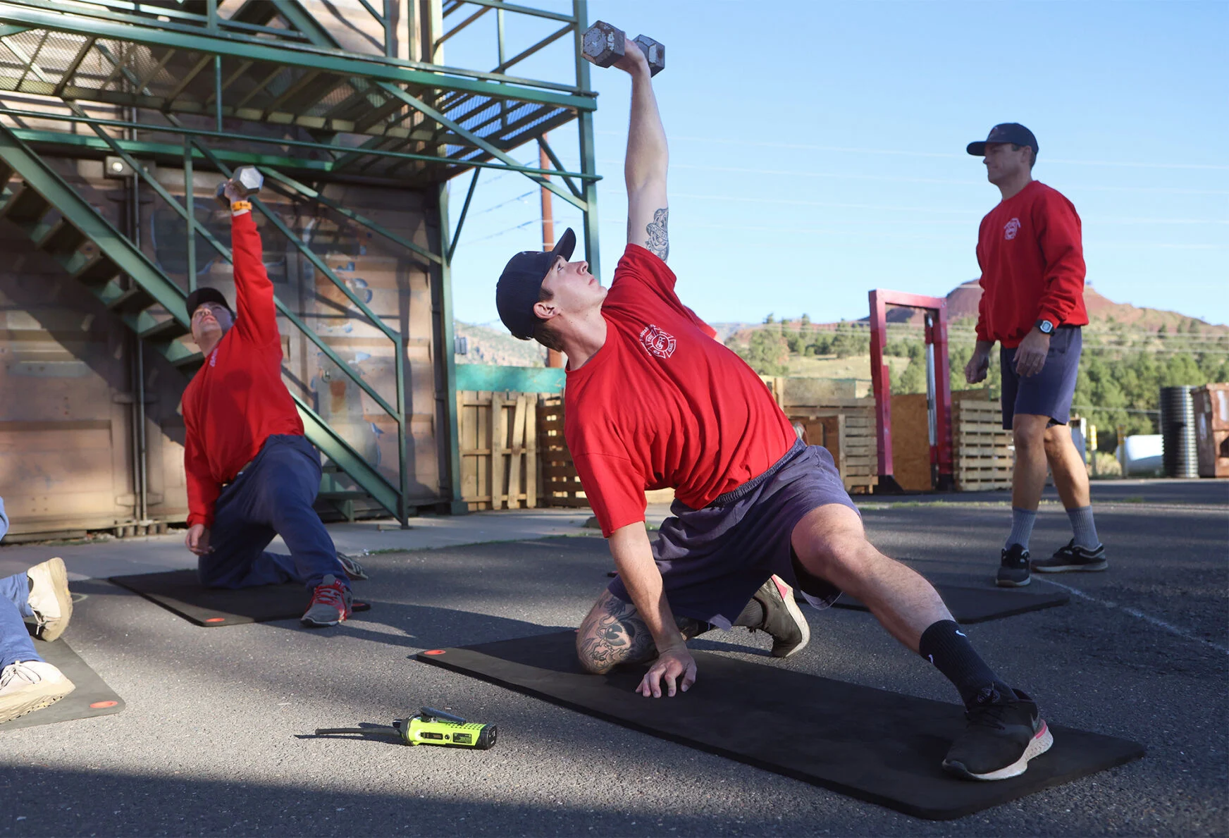 Tanor Loosle, Greater Flagstaff Region Fire Academy recruit, completes an exercise during an athletic training program session at the Flagstaff Fire Department training tower.