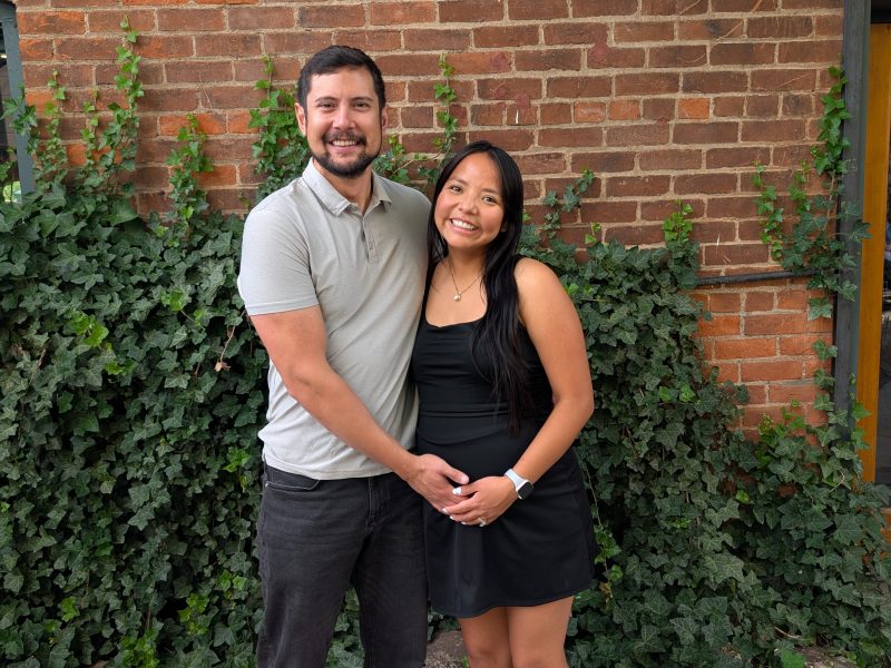 Chad Web and his wife in front of health professions building.