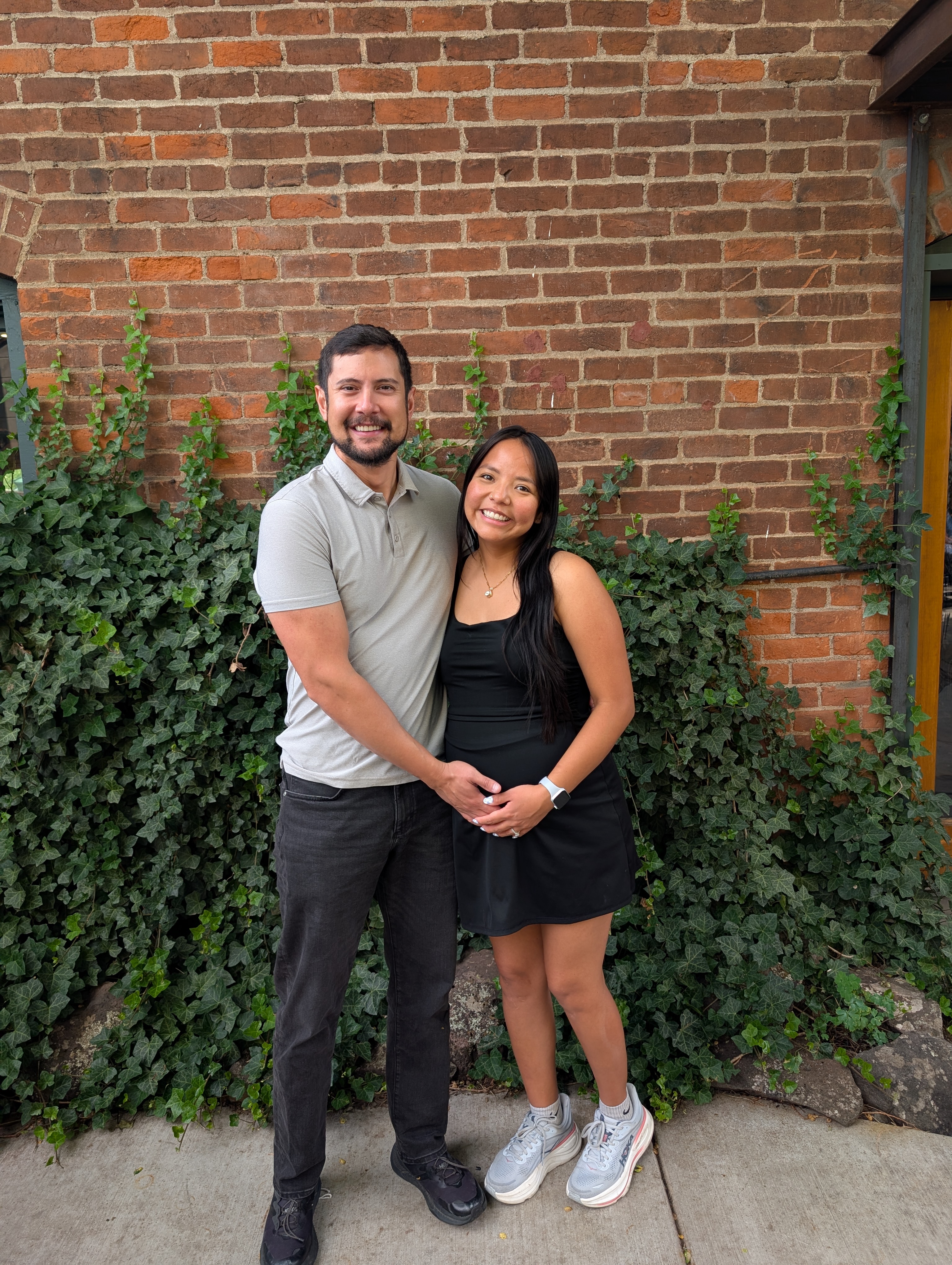 Chad Web and his wife in front of health professions building.