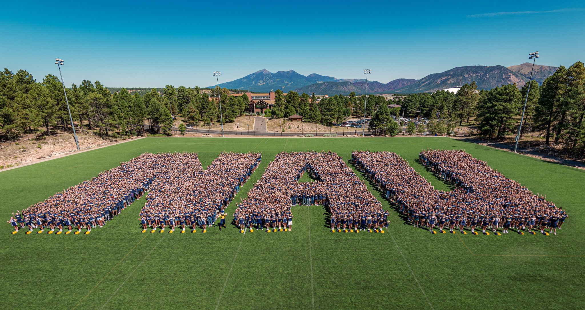 Northern Arizona University students aligned to spell out N A U.