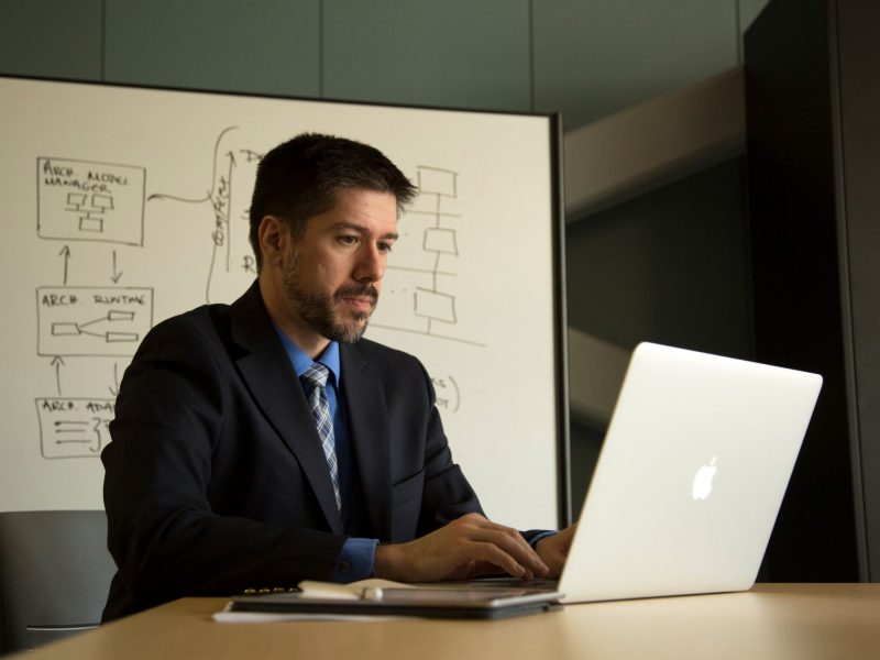 John Georgas working on a laptop.
