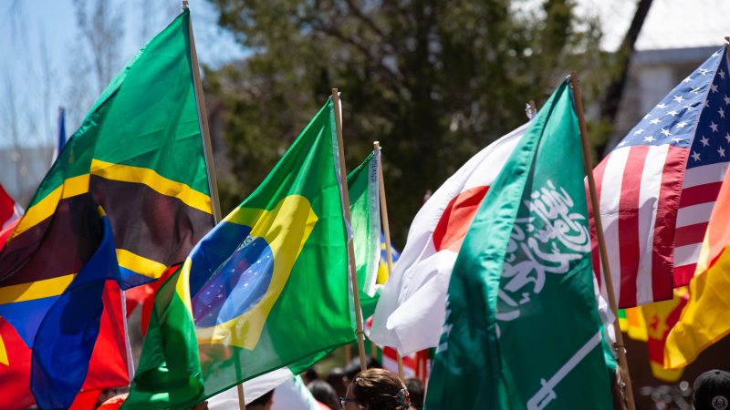 International flags at homecoming 2023.