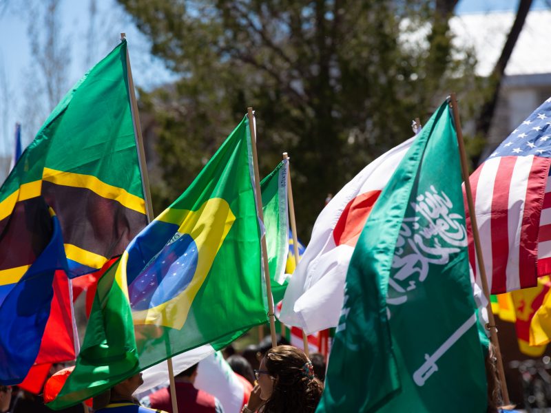 International flags at homecoming 2023.