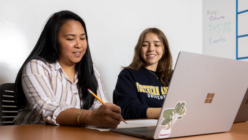 An H R M advsing appointment between an advisor and student.