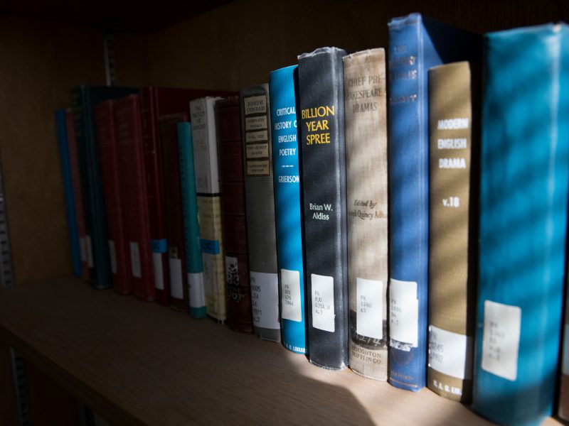 Northern Arizona University books on a shelf.
