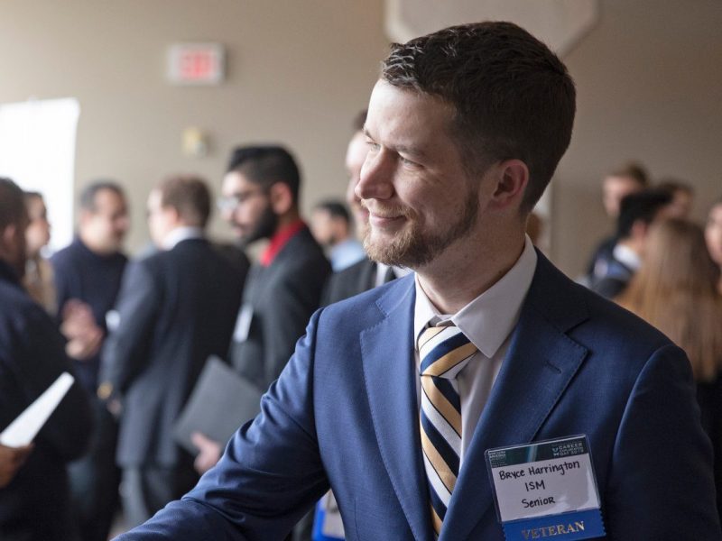 Students and employers participating in a career fair.