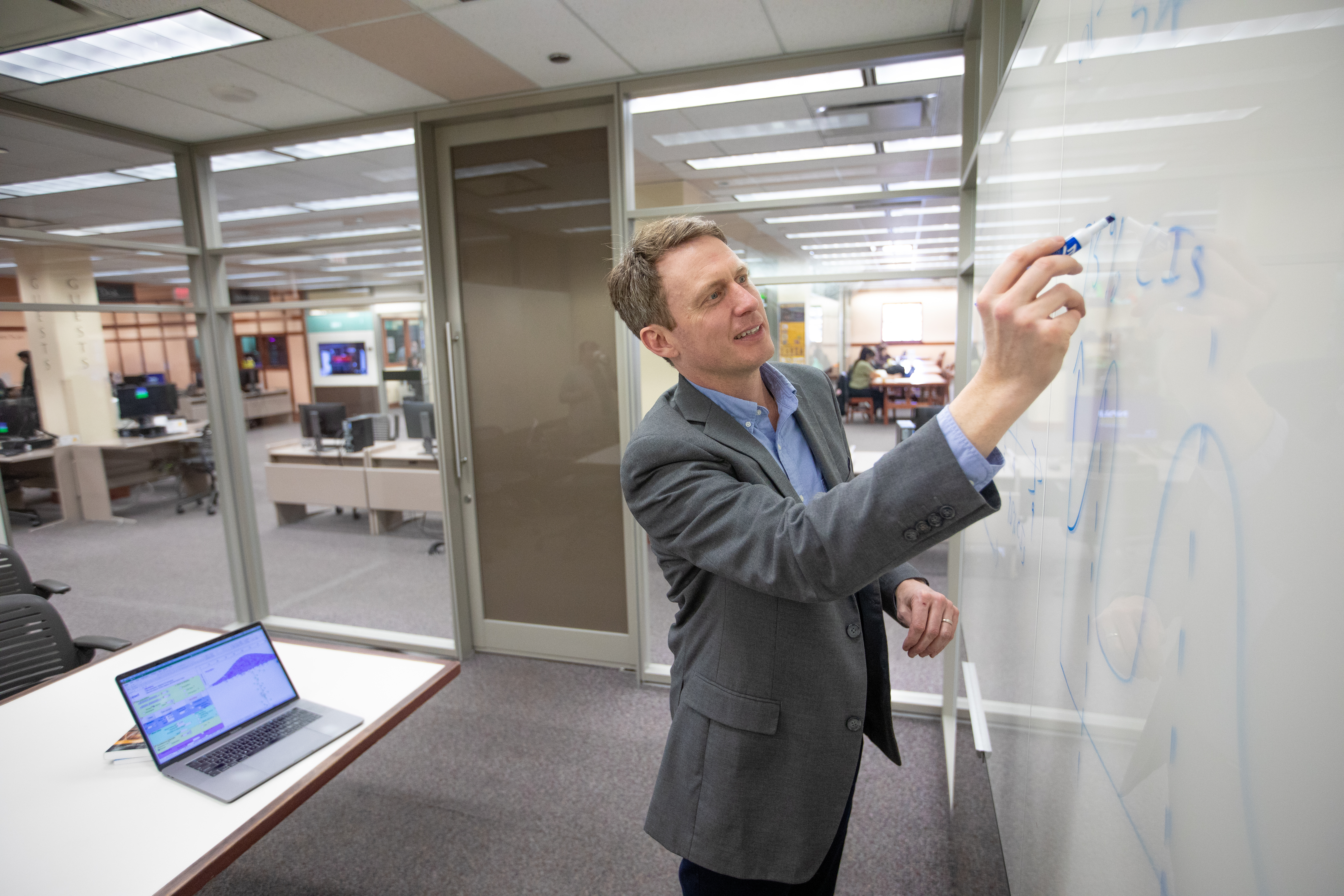 H R M student working in Cline library.