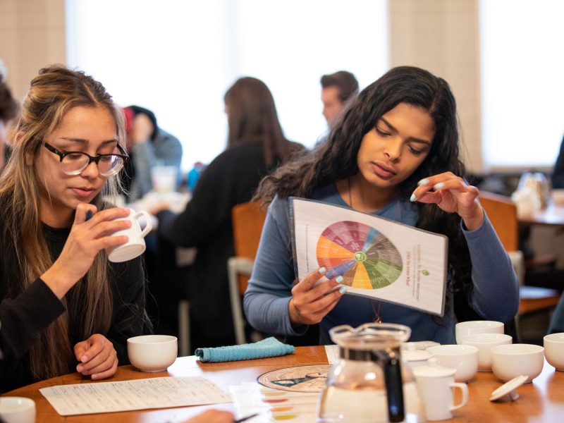 Students participate in a breakfast meeting.