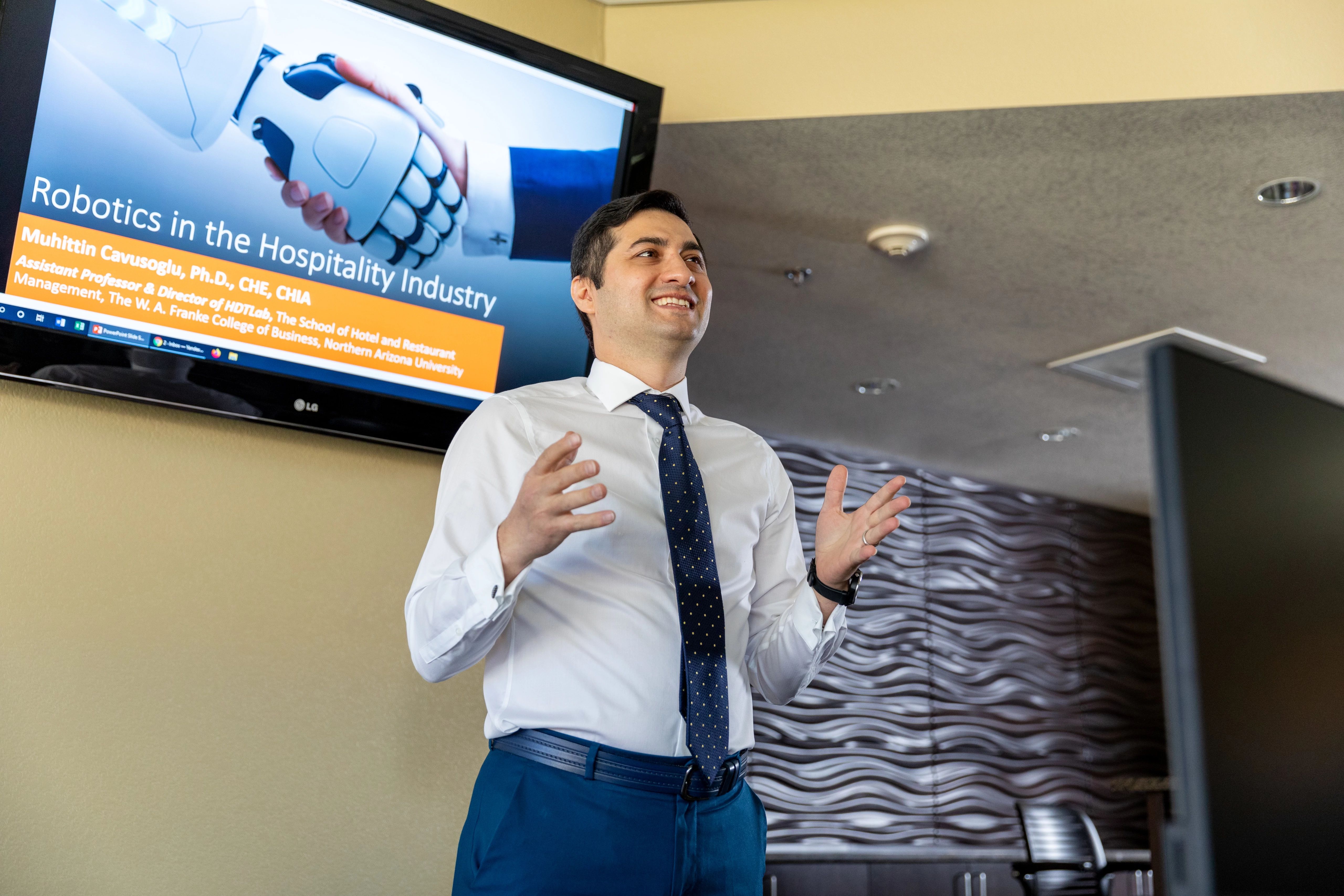 H R M student speaking to an audience.