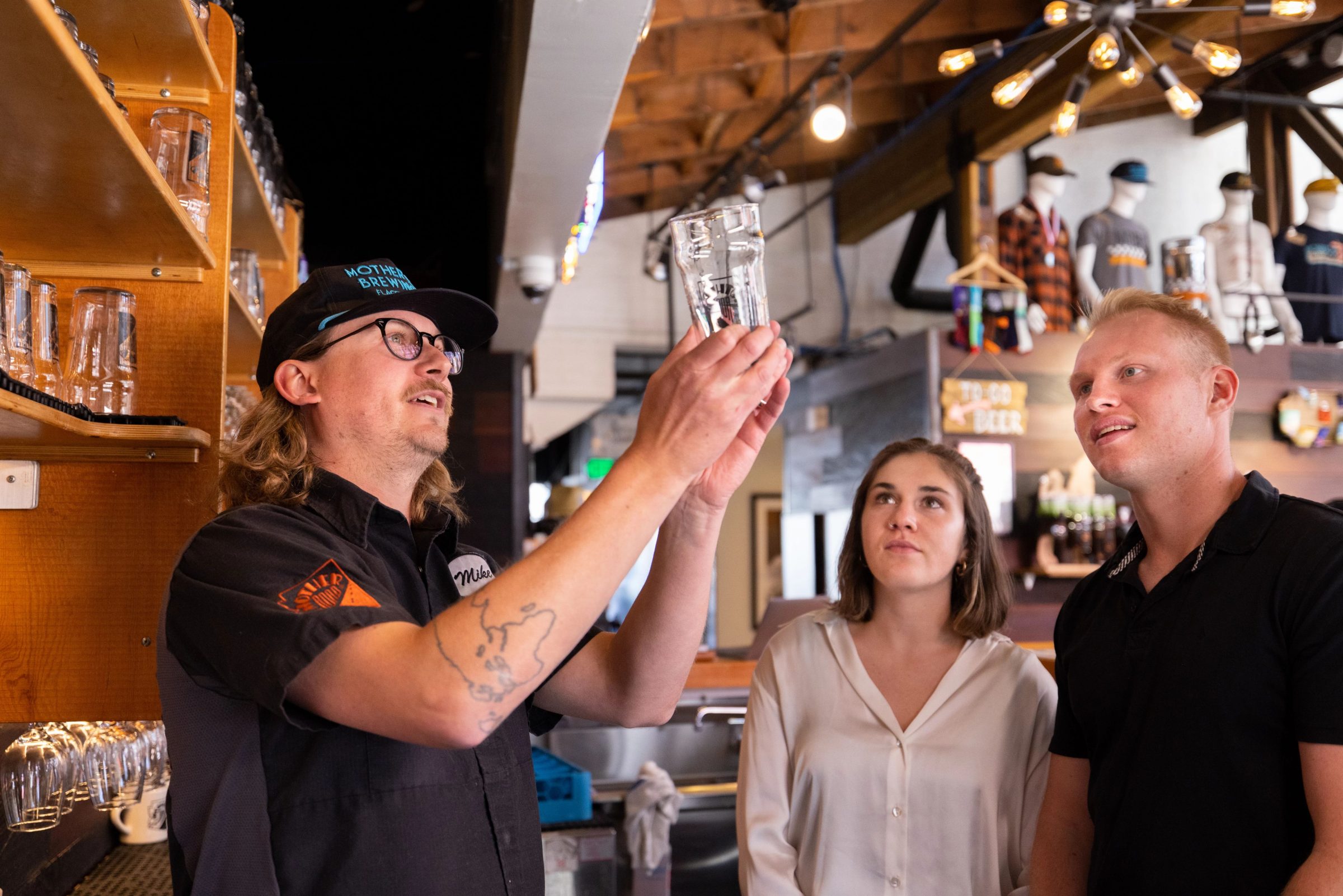 Students looking at a glass.