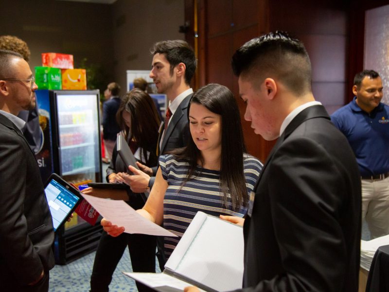 Students conversing at the Career Fair.