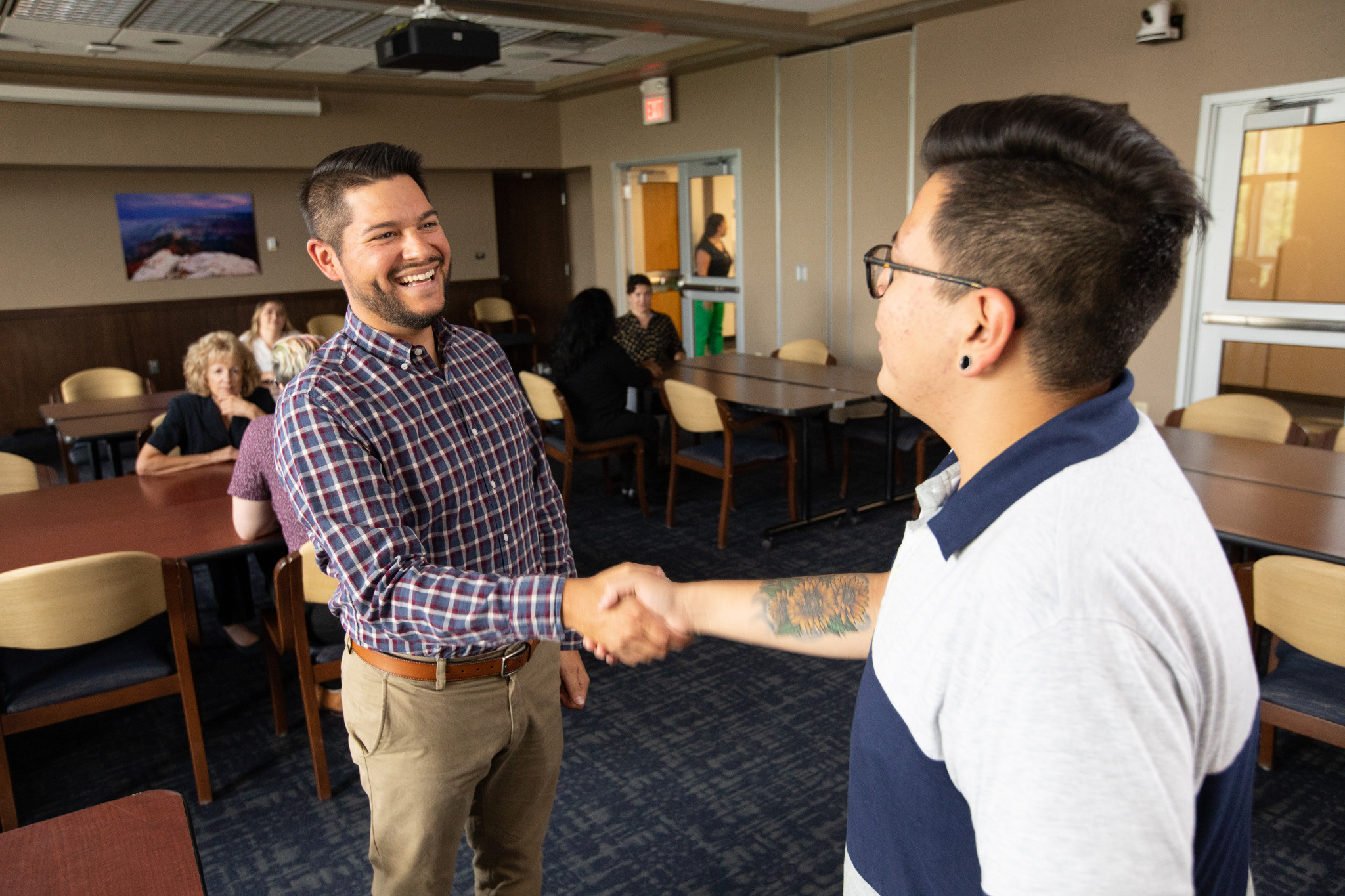 Students meeting faculty to help with their career goals.