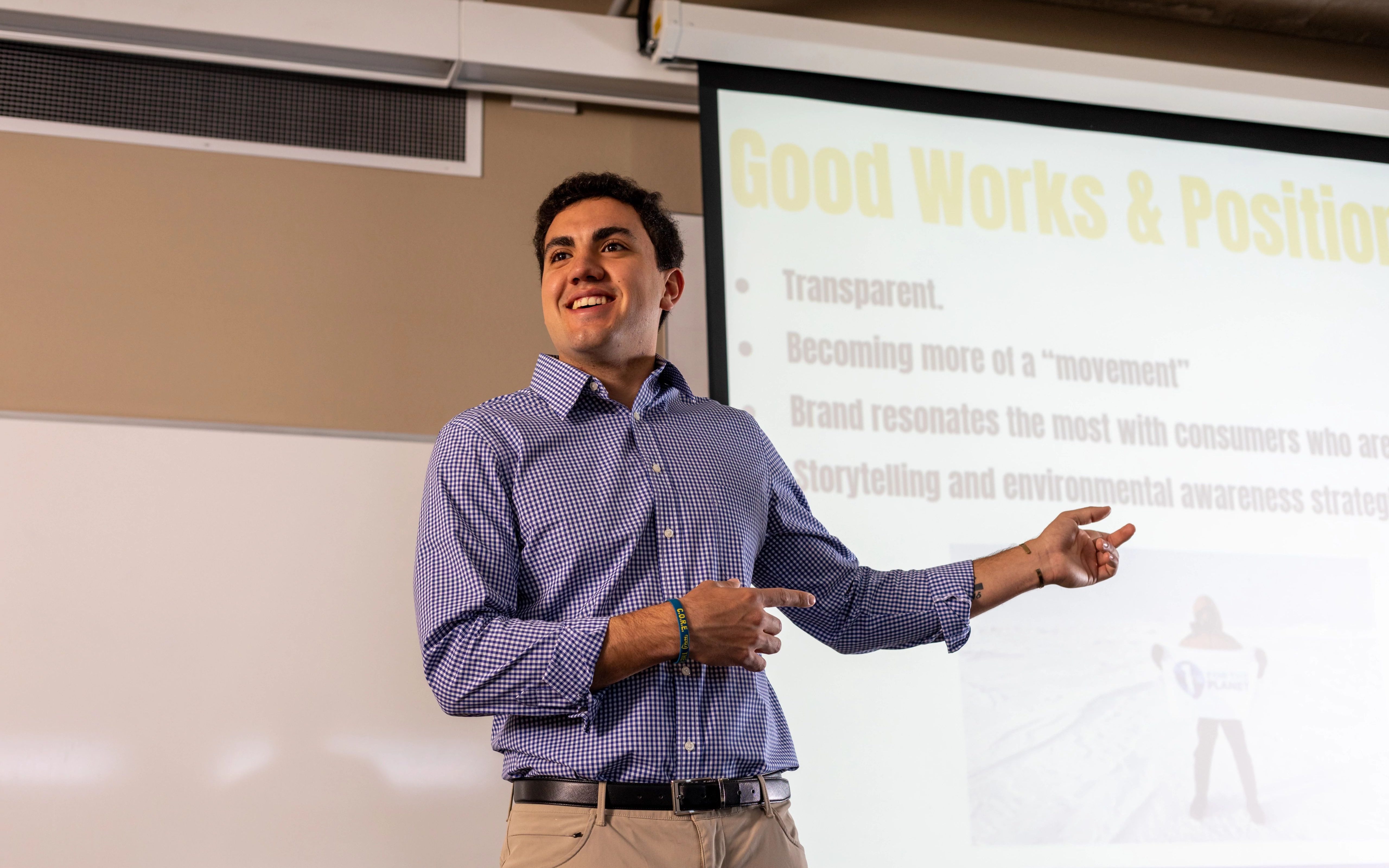 Student presenting a project in the business building.