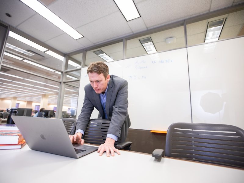 Finance student working in the cline library.