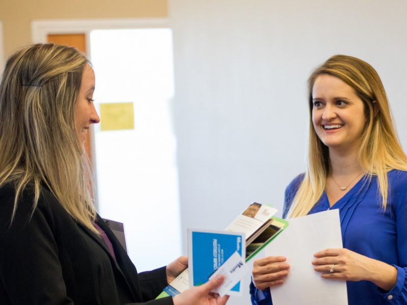 Students and employers participating in a career fair.