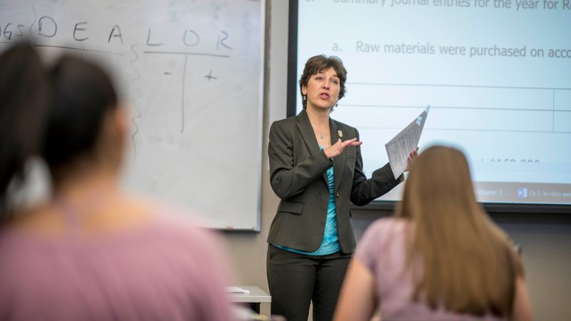 Professor at the business college explains computer graphics.