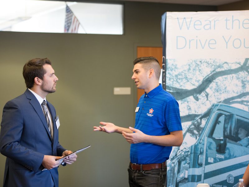 Students and employers participating in a career fair.