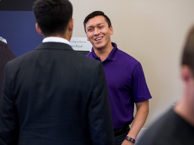 Students and employers participating in a career fair.