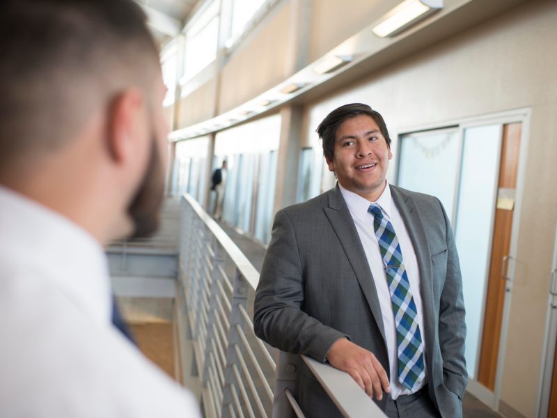 Students talking in the halls of The W A Franke College of Business.